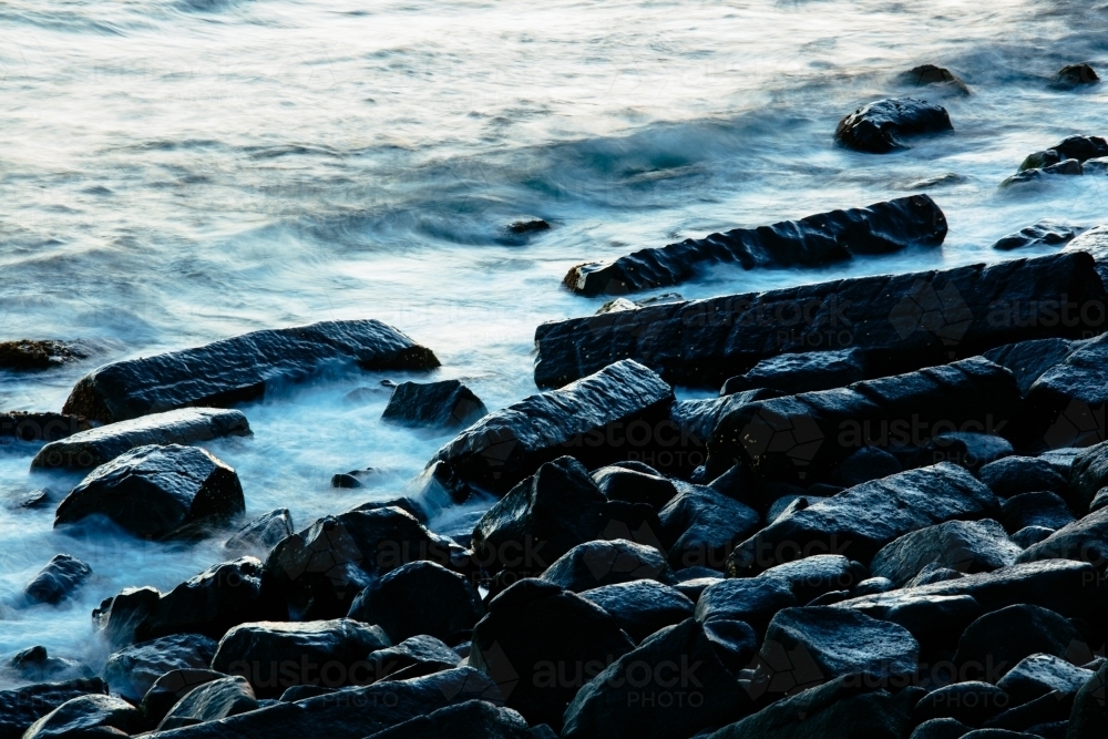 Basalt Rocks and Waves at Burleigh Head - Australian Stock Image