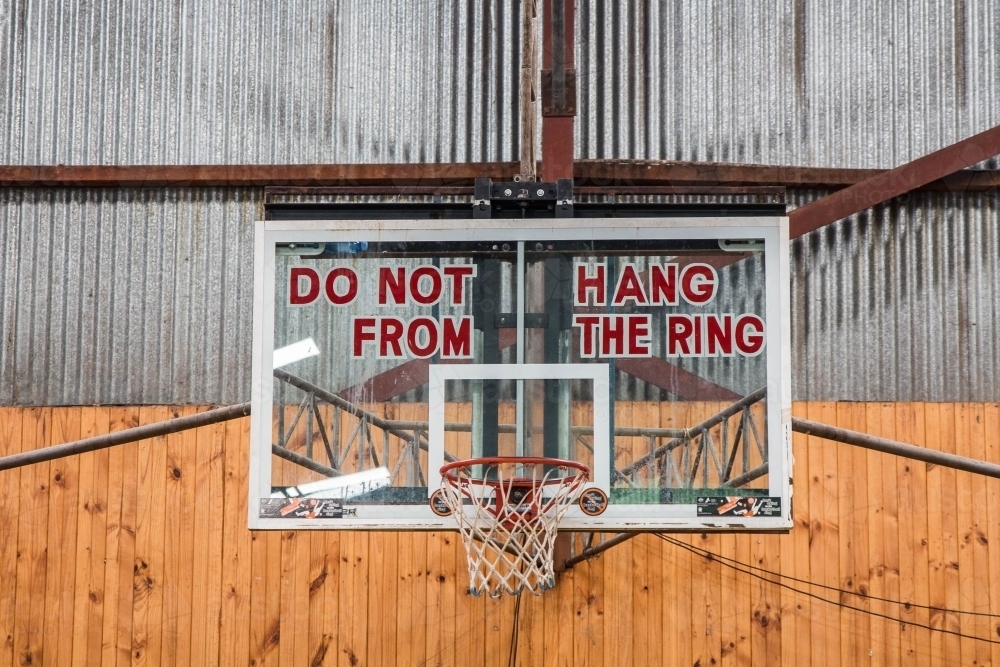 Basketball hoop with sign do not hang from the ring - Australian Stock Image