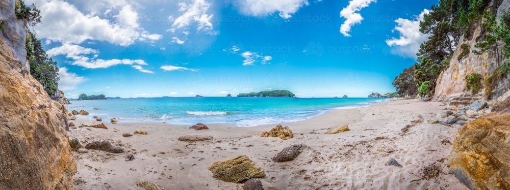 Beach cove surrounded by sandstone cliffs - Australian Stock Image