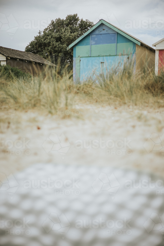 Beach hut in Melbourne Victoria with a picnic blanket - Australian Stock Image