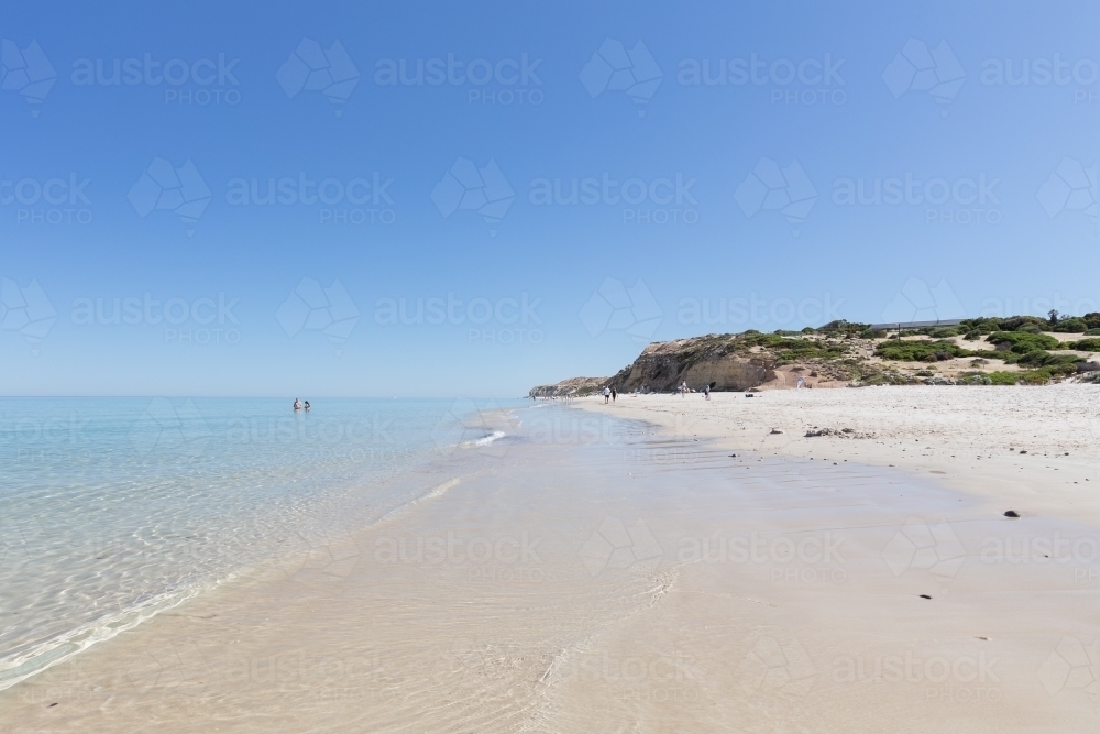 Beach on a clear day with no waves - Australian Stock Image