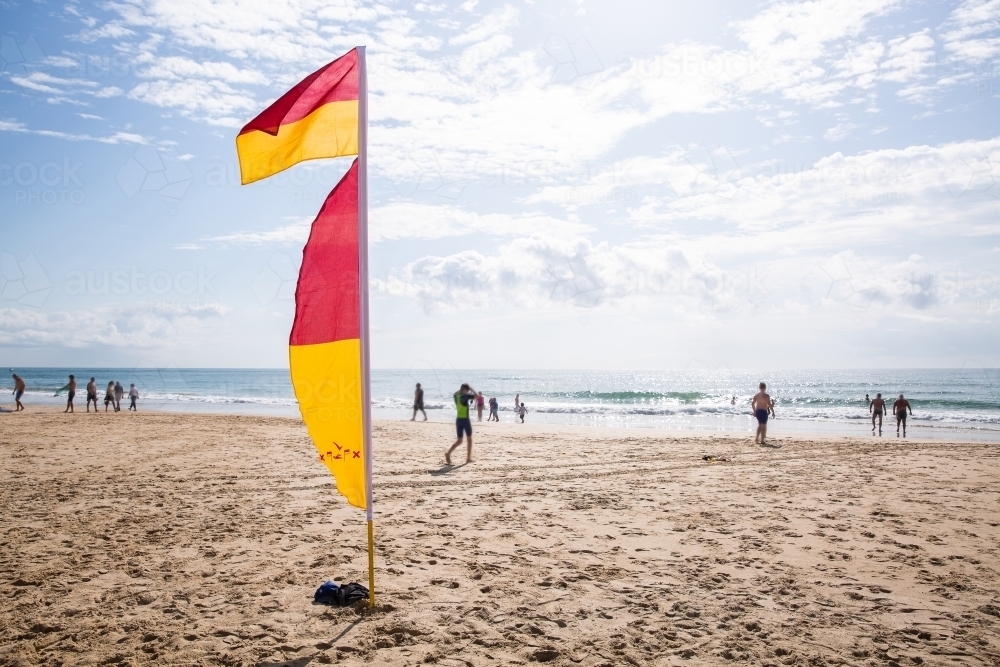 beach red and yellow flags for swimming safely - Australian Stock Image