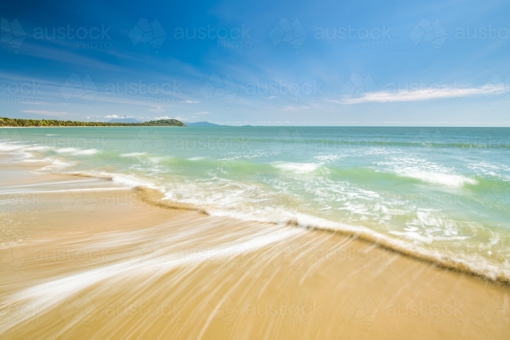 Beach waves on a sunny day - Australian Stock Image