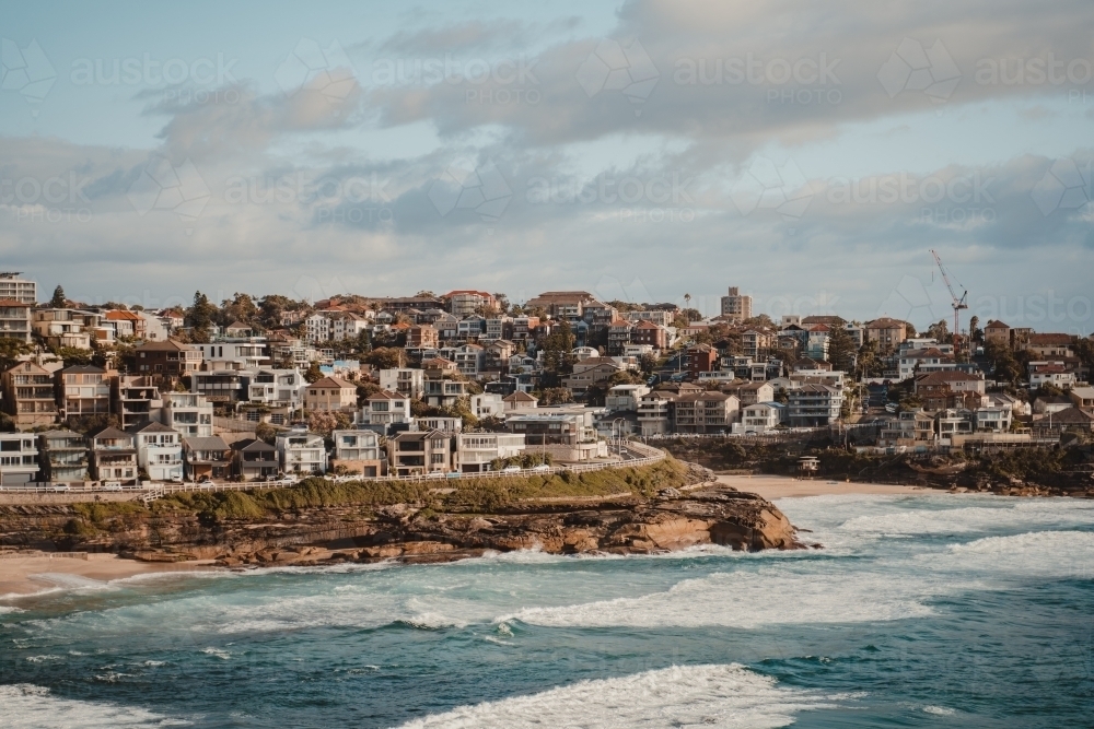 Beachfront property on North Bronte headland and Tamarama on a sunny morning - Australian Stock Image