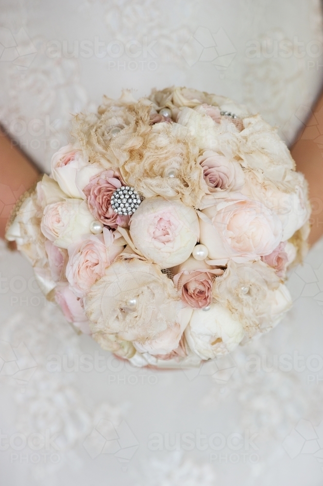 beautiful vintage soft pink wedding bouquet with bridal gown - Australian Stock Image