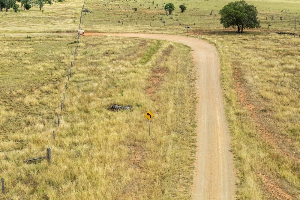 Bend on a dirt road on farm. - Australian Stock Image