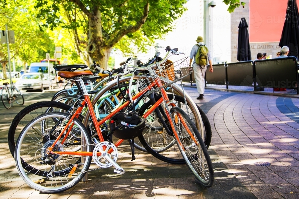 Bicycle rack full of bikes on a city street - Australian Stock Image