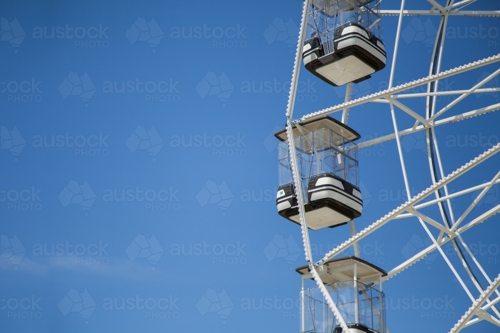 Black and white ferris wheel amusement ride - Australian Stock Image