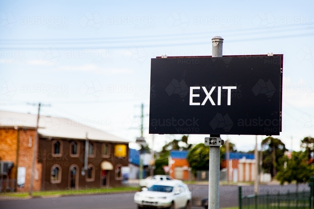 Image of Black exit sign with copy space in country town - Austockphoto