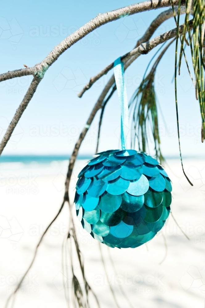 blue christmas ornament at the beach - Australian Stock Image