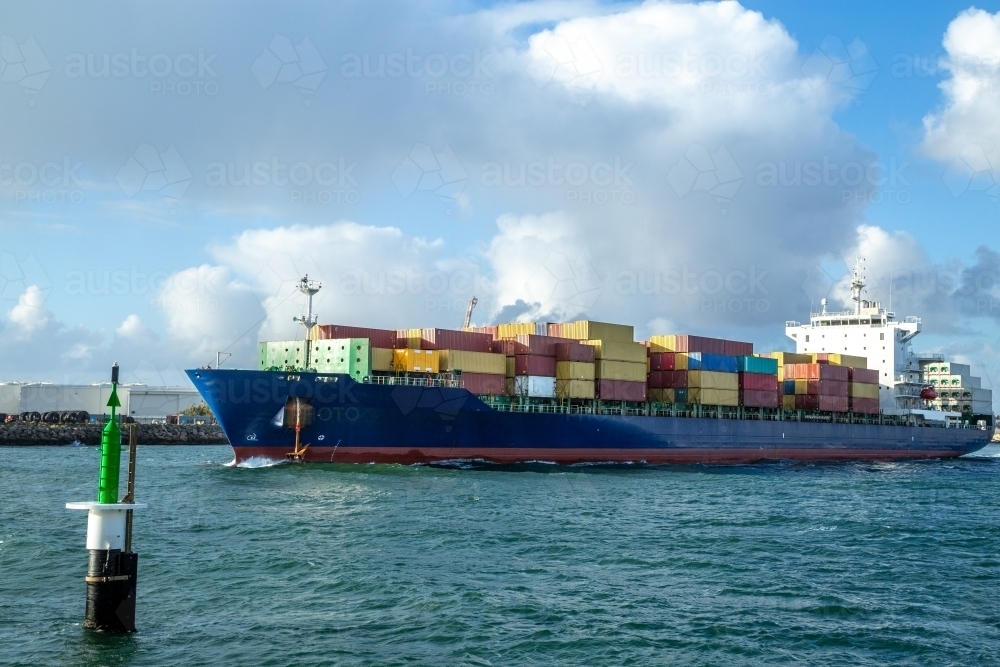 Blue hulled container ship departing Port of Fremantle. - Australian Stock Image