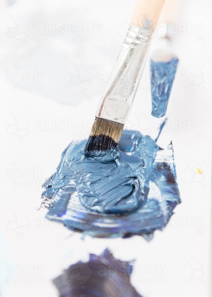 Blue paint on the palette - Australian Stock Image