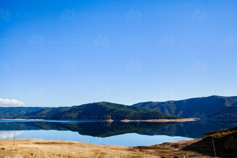 Blue sky and mountains with lake, Blowering Reservoir - Australian Stock Image