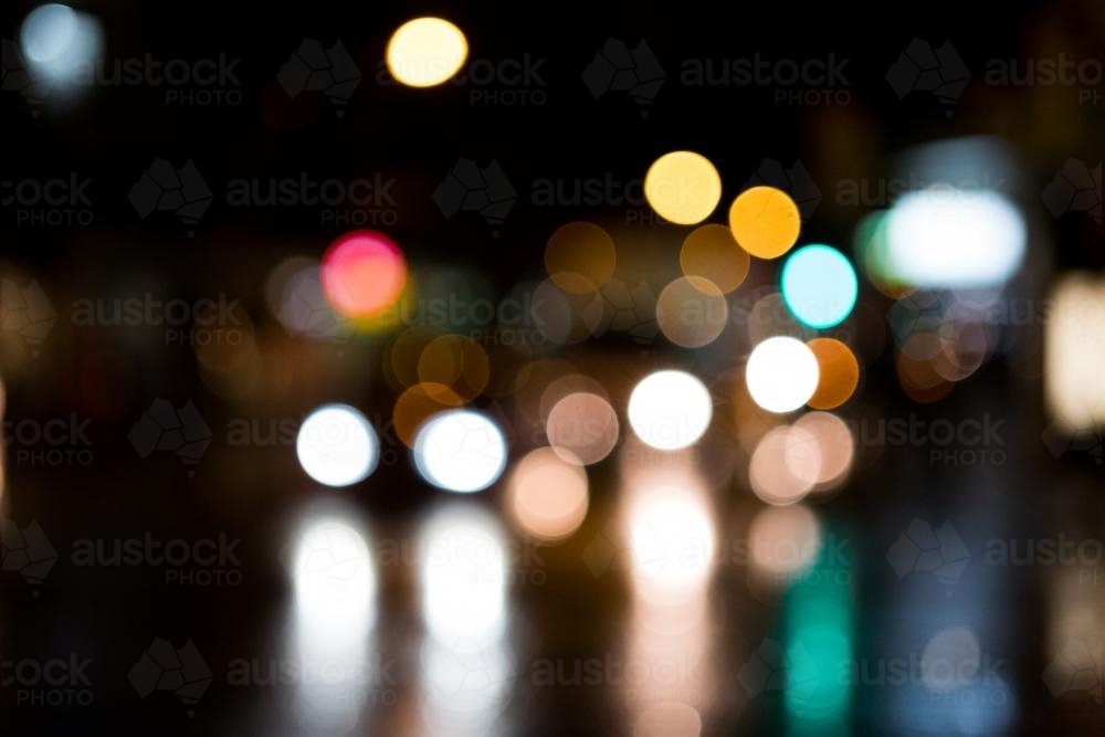 Image of Blurry lights of oncoming traffic at night ...