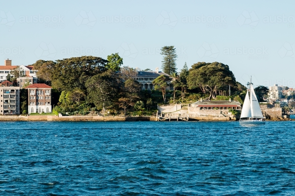 Boat sailing past Kirribilli Point from Sydney Harbour - Australian Stock Image