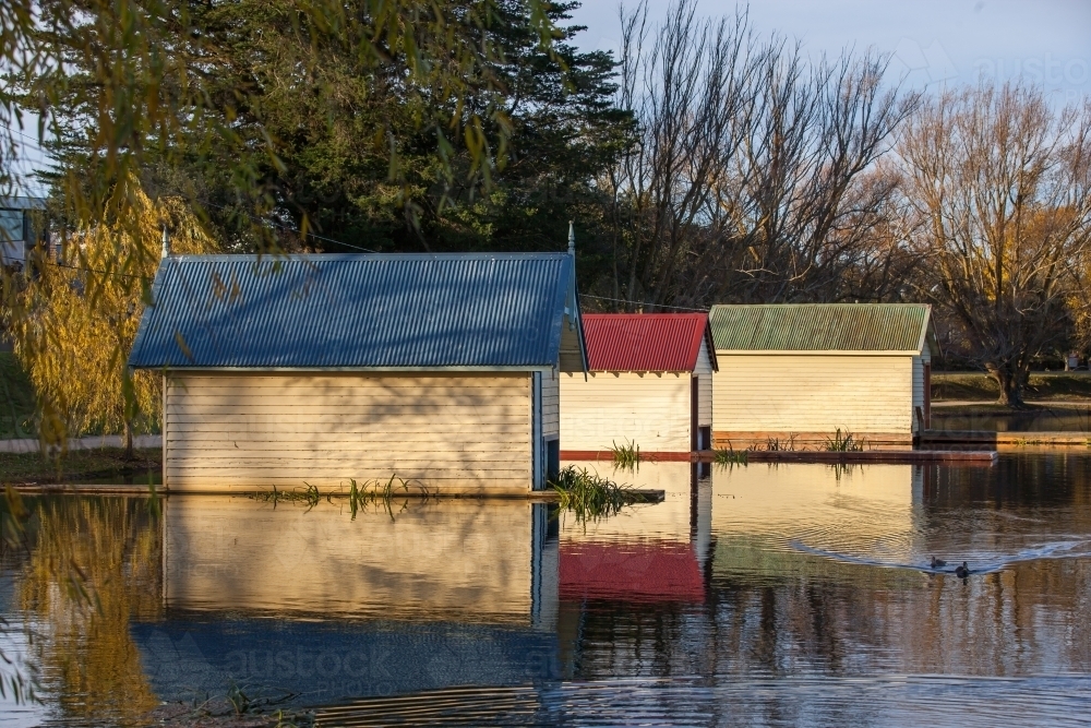 Boatsheds on lake - Australian Stock Image