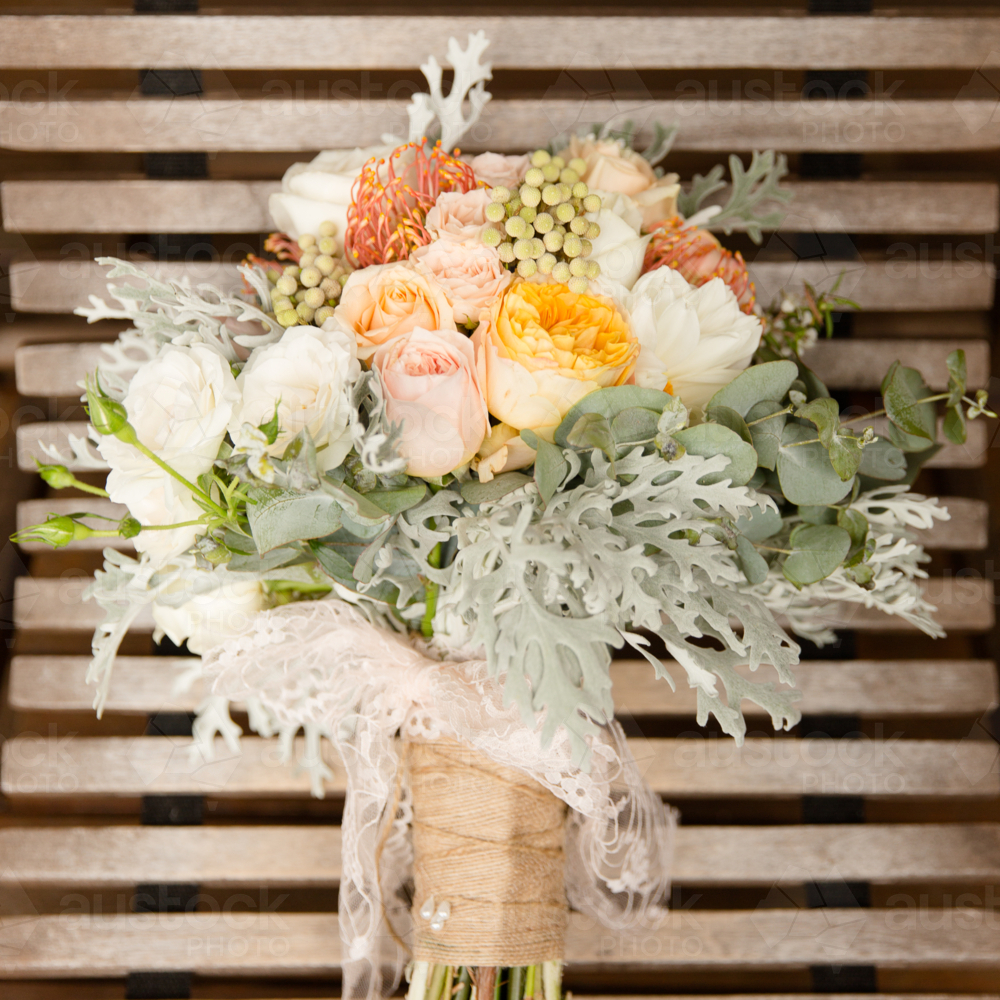 bouquet of flowers with dusty green and orange tones - Australian Stock Image