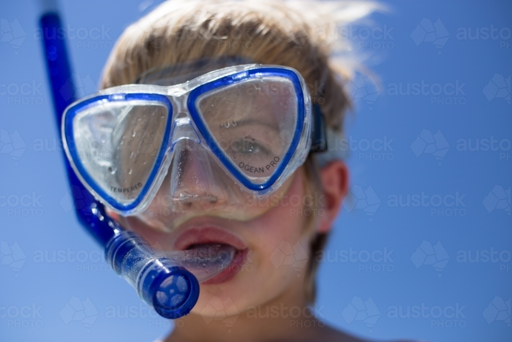 Boy with snorkle and goggles - Australian Stock Image