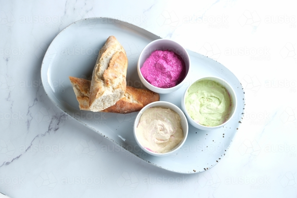 Bread on a ceramic dish with dips - Australian Stock Image