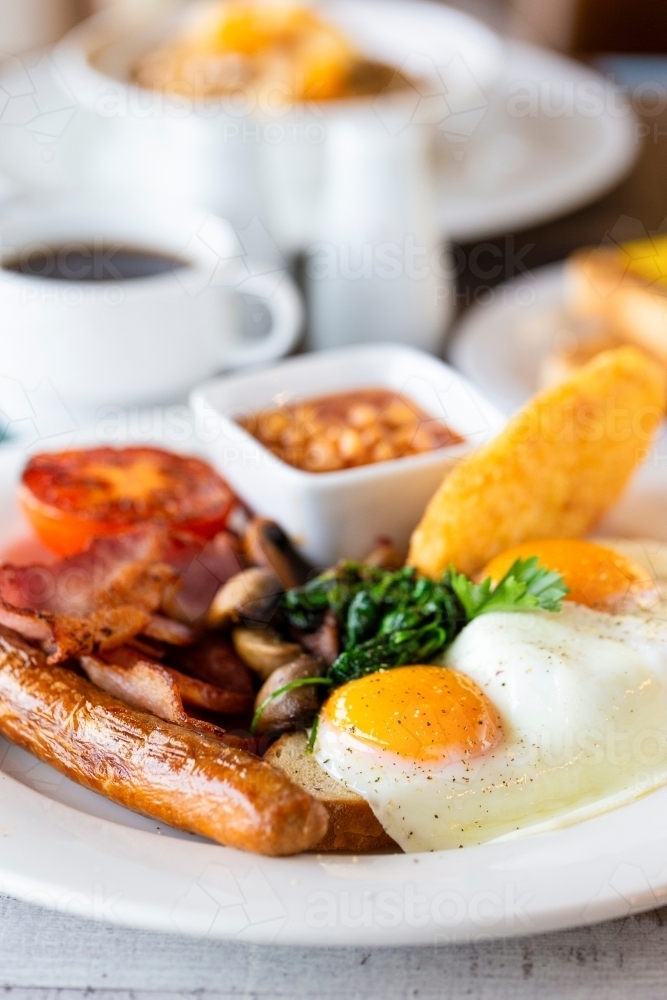 Breakfast dish with fried egg and sausage - Australian Stock Image