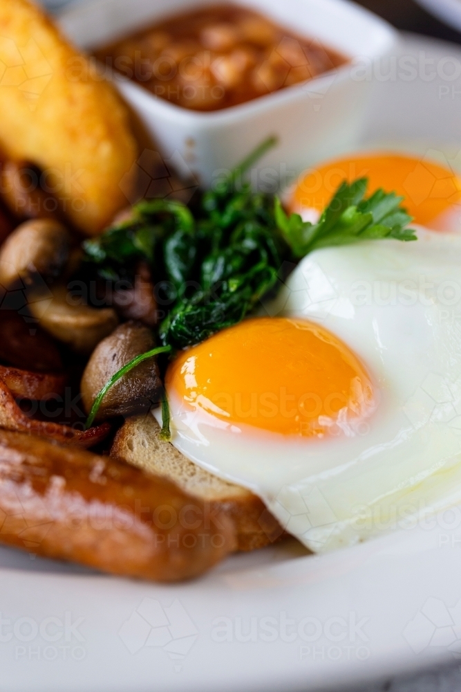 Breakfast dish with fried egg and sausage - Australian Stock Image