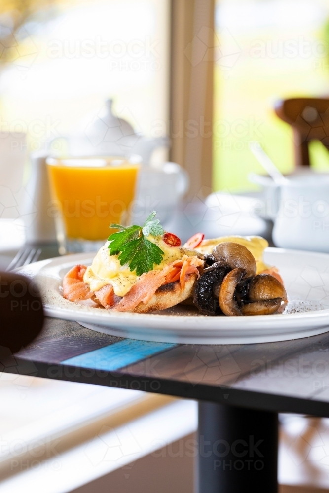 Breakfast dish with scrambled egg in restaurant - Australian Stock Image