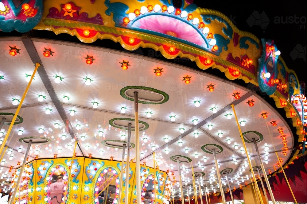 bright lights on a carousel ride at night - Australian Stock Image