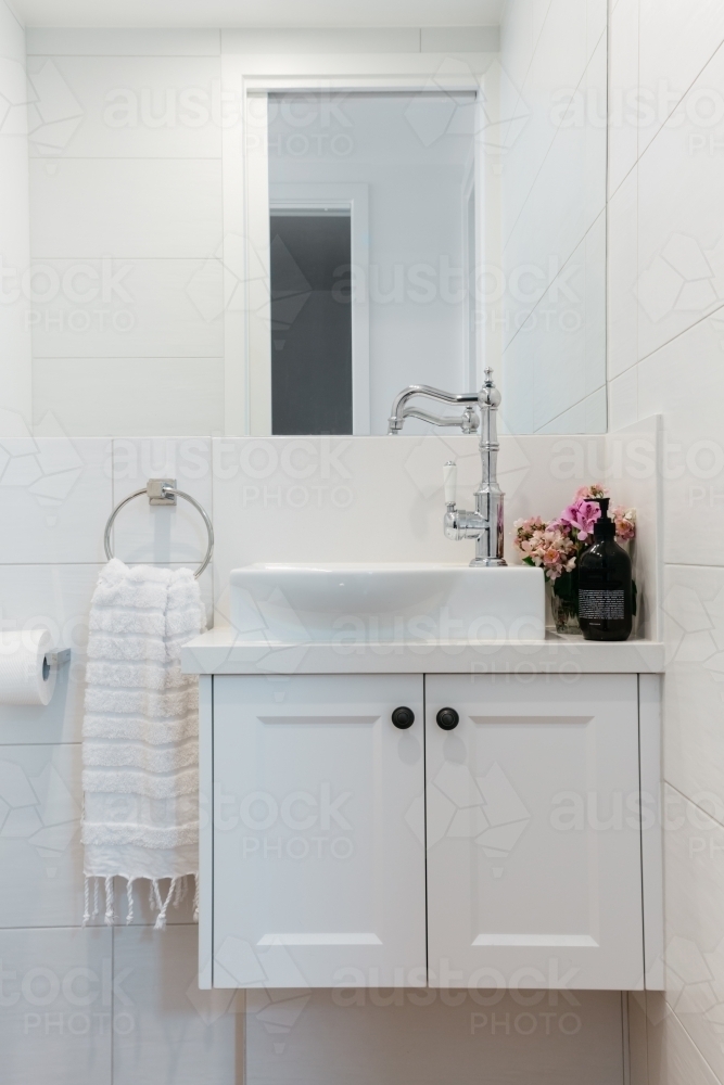 Bright white contemporary powder room in an Australian home - Australian Stock Image