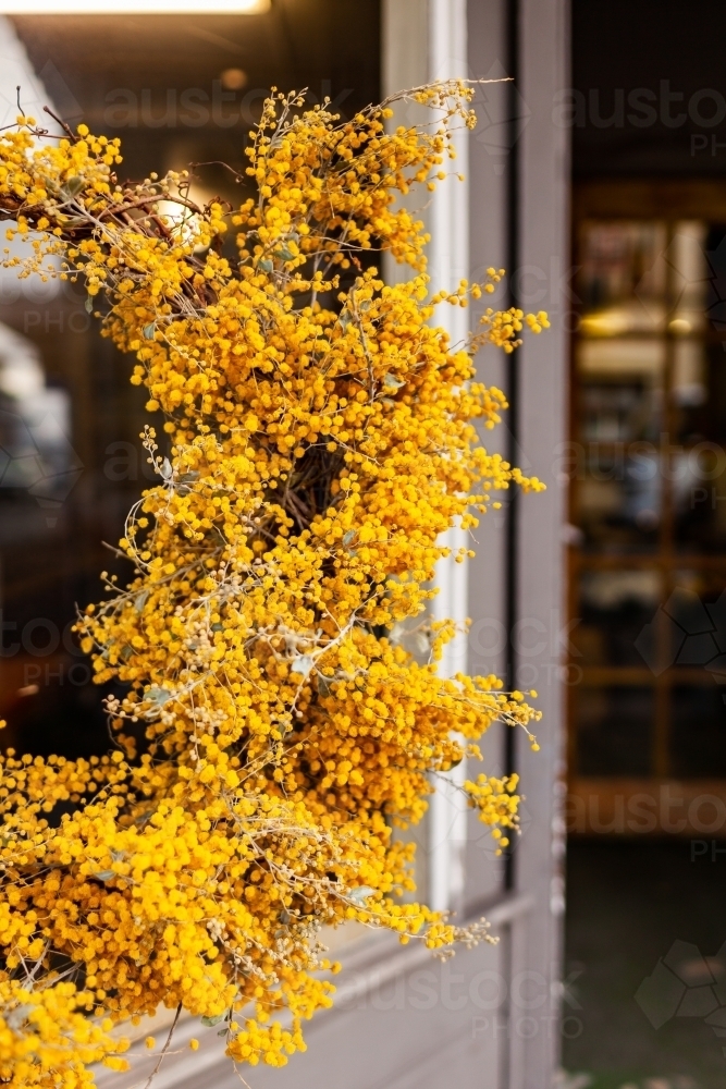 Bright yellow native flower wreath of wattle - Australian Stock Image