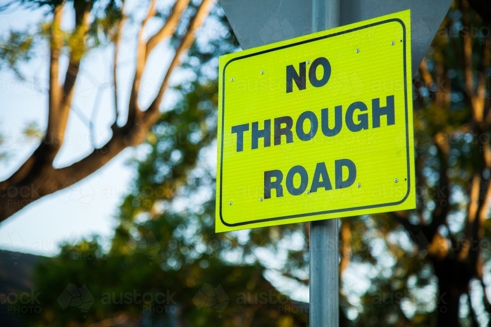 Bright yellow reflective no through road sign - Australian Stock Image