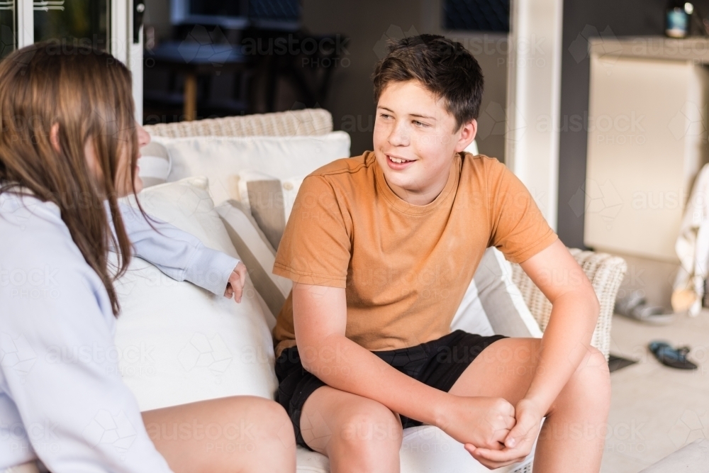 brother and sister talking - Australian Stock Image