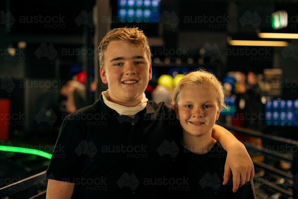 Brothers hanging out at indoor Go Kart track - Australian Stock Image