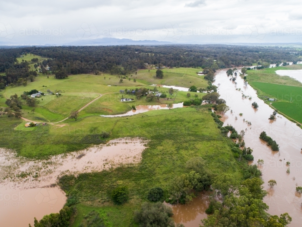 Brown floodwaters of Hunter River in Singleton - Australian Stock Image