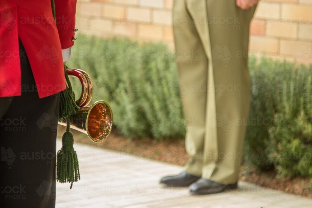 Bugle player and soldier at the ANZAC Day service - Australian Stock Image