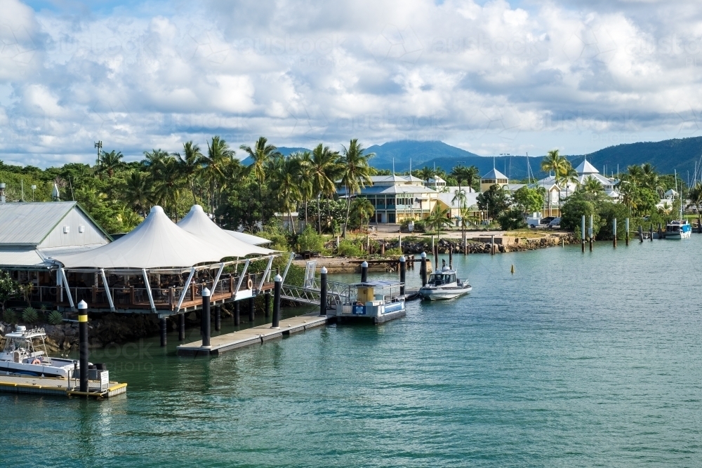 Building structures at the Port Douglas marina on bright day - Australian Stock Image