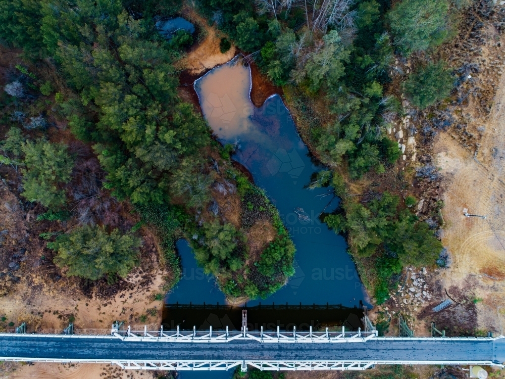 Bulga bridge over stagnant creek on overcast day - Australian Stock Image