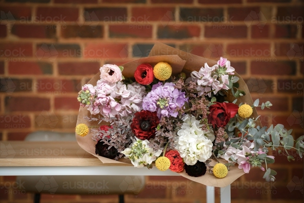 Bunch of cut cottage flowers in rustic country setting - Australian Stock Image
