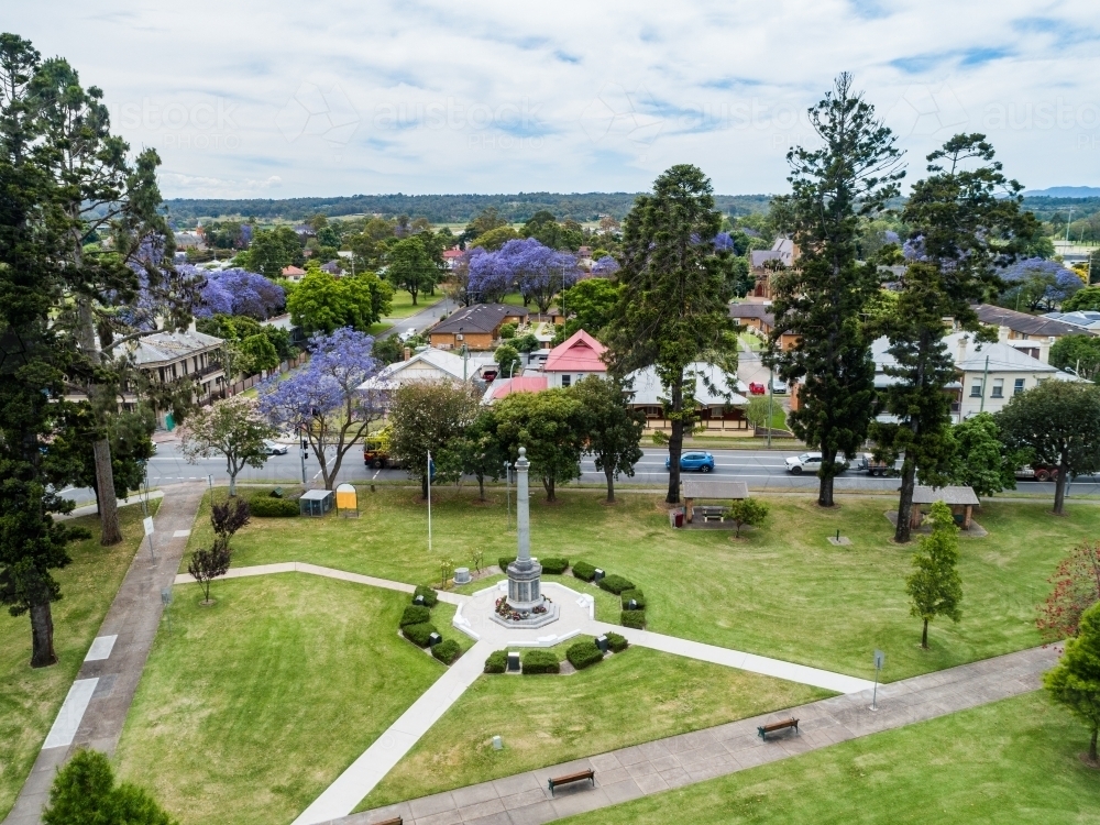 Burdekin Park cenotaph with remembrance day wreaths laid around it seen from aerial view - Australian Stock Image