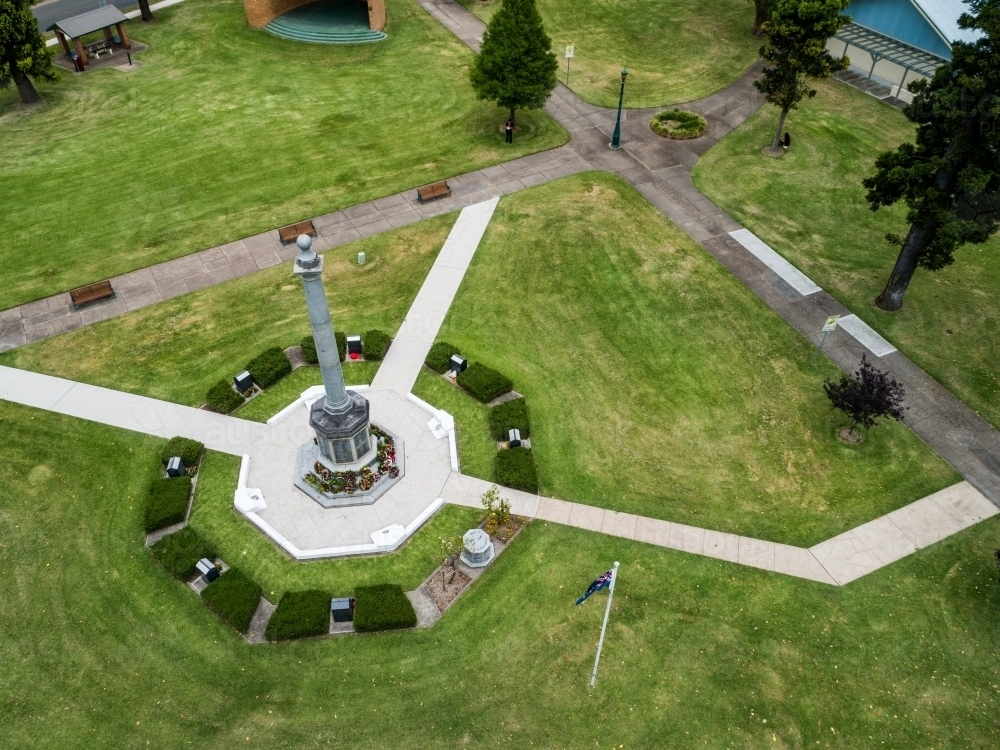 Burdekin Park cenotaph with remembrance day wreaths laid around it seen from aerial view - Australian Stock Image