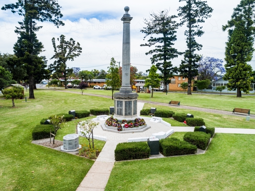 Burdekin Park cenotaph with remembrance day wreaths laid around it seen from aerial view - Australian Stock Image