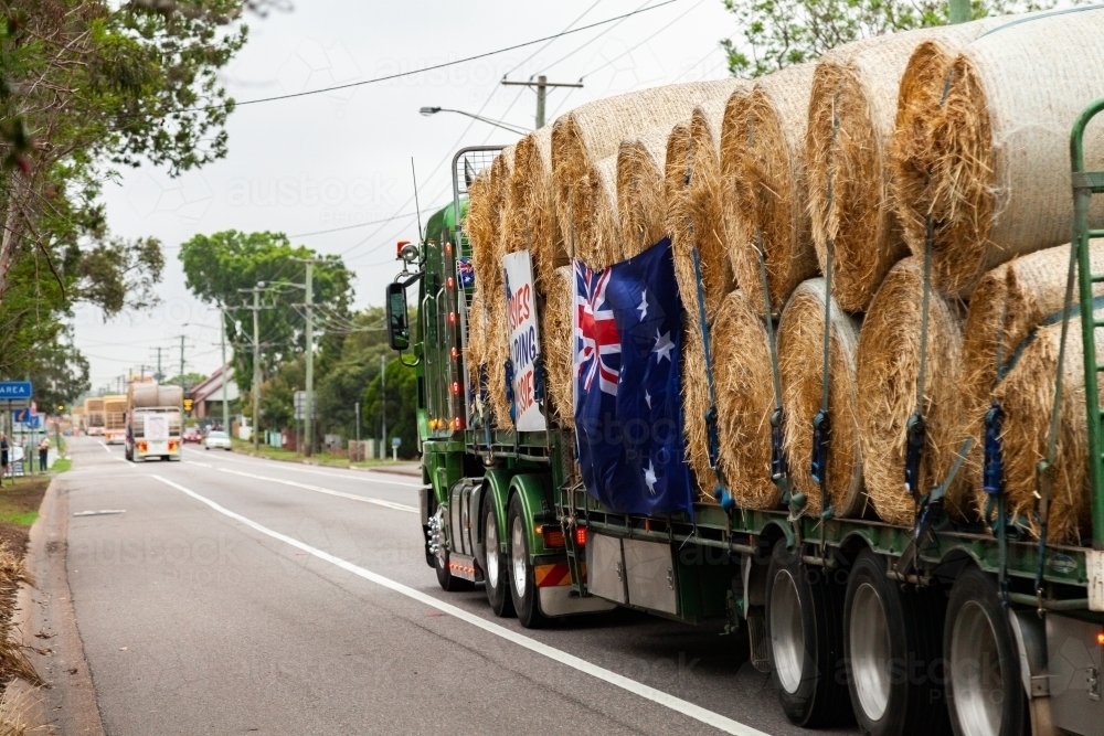 Burrumbuttock Hay Runners going through Singleton on their way to assist farmers - Australian Stock Image