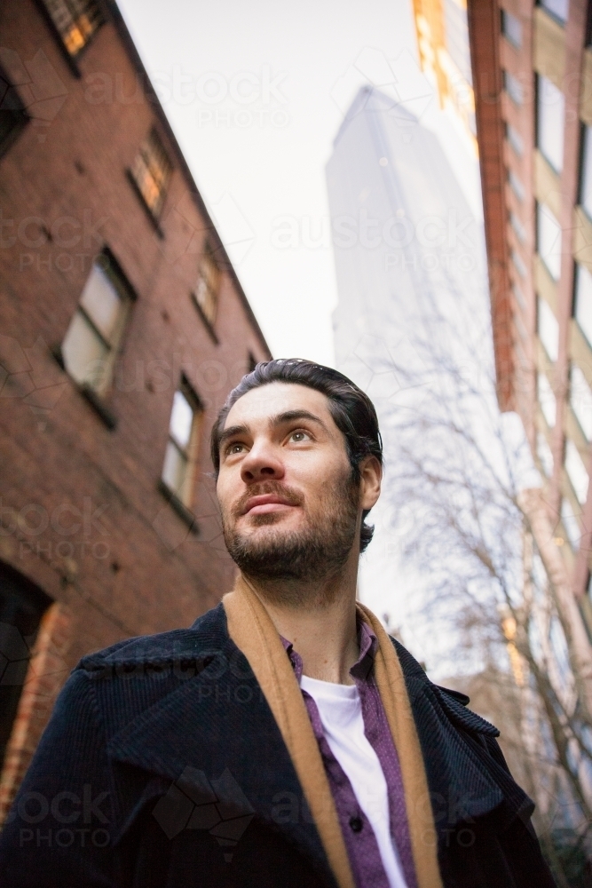 Business Man Surrounded by the Buildings of Melbourne - Australian Stock Image