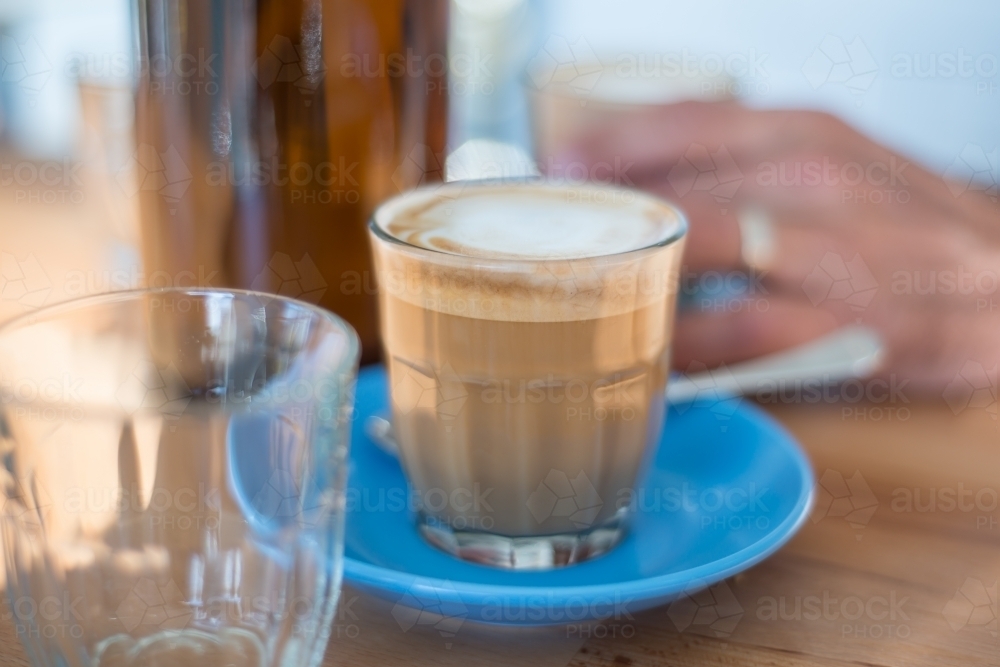 Cafe coffee on blue saucer - Australian Stock Image