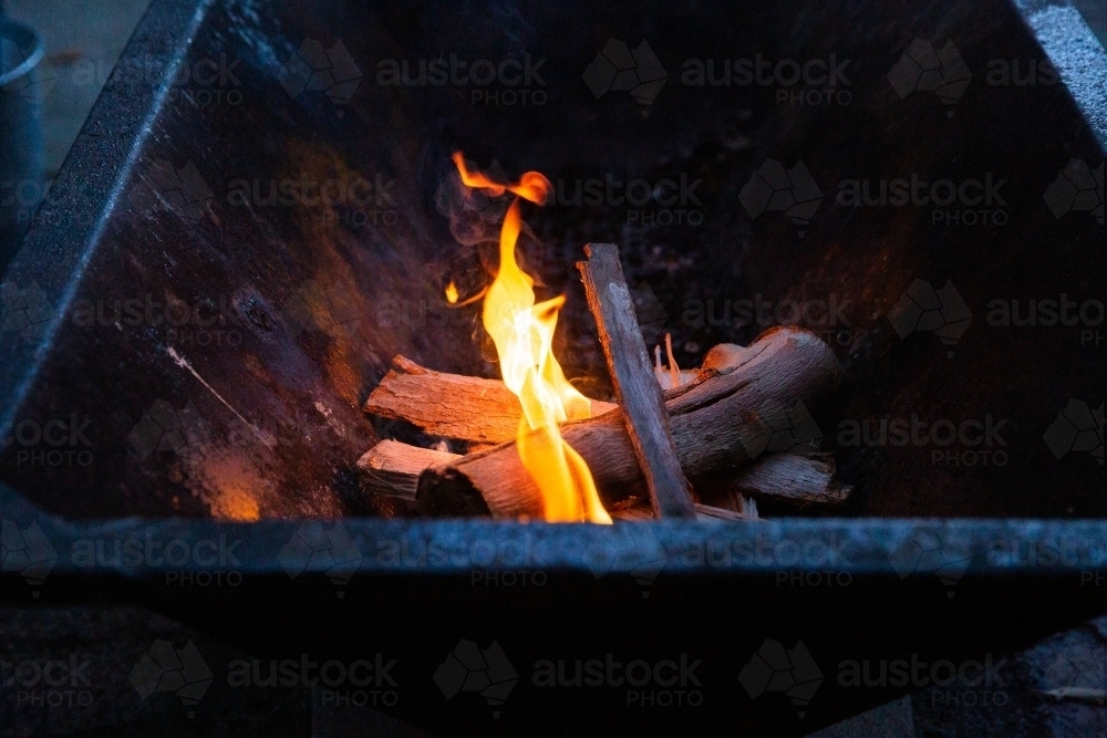 campfire in a fire pit - Australian Stock Image