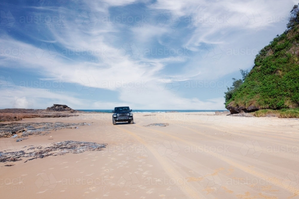 car driving on beach - Australian Stock Image