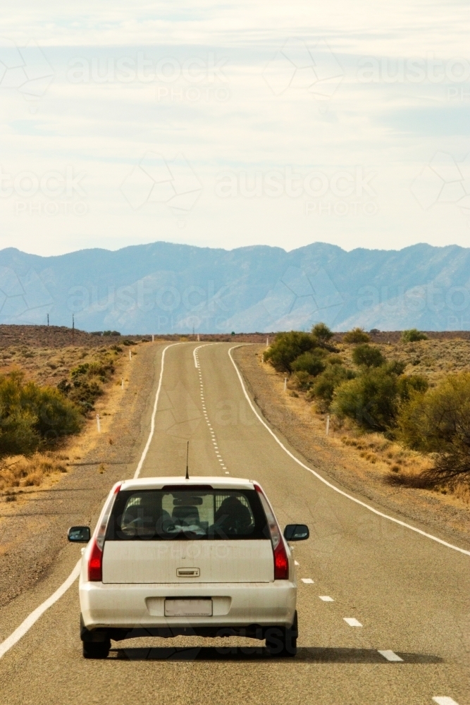 Car driving towards hills - Australian Stock Image