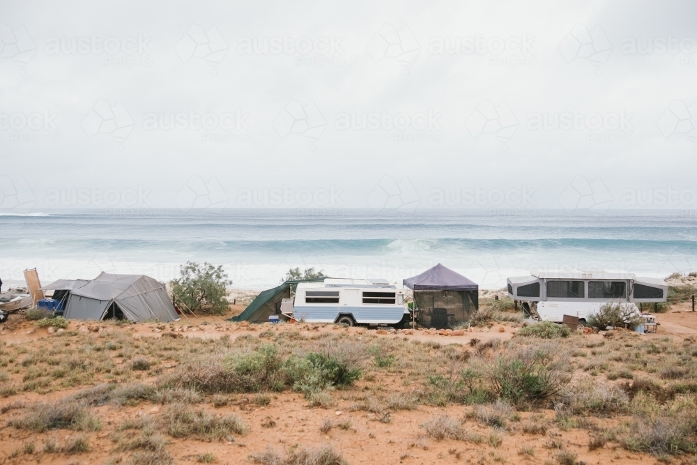 Caravans and campers along the Western Australian coastline with ocean in background - Australian Stock Image