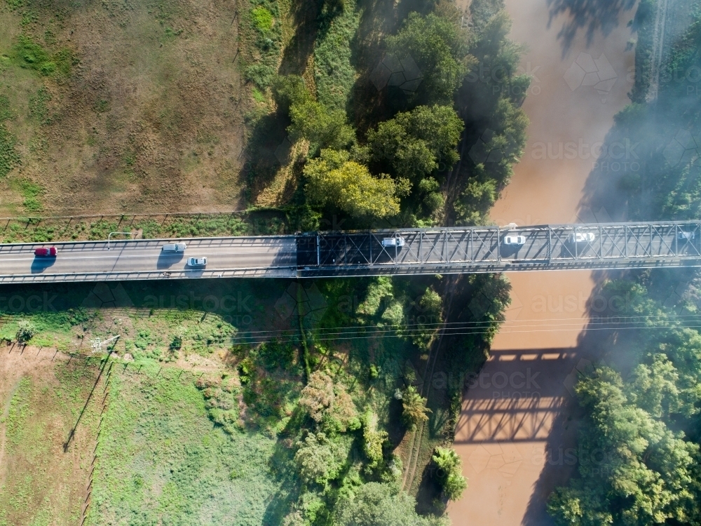 Cars crossing river on Dunolly Ford Bridge in Singleton - Australian Stock Image