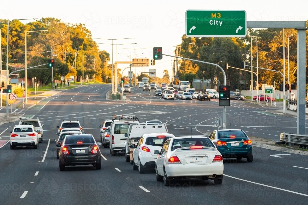 Cars stopped at city traffic lights - multi lane intersection - Australian Stock Image