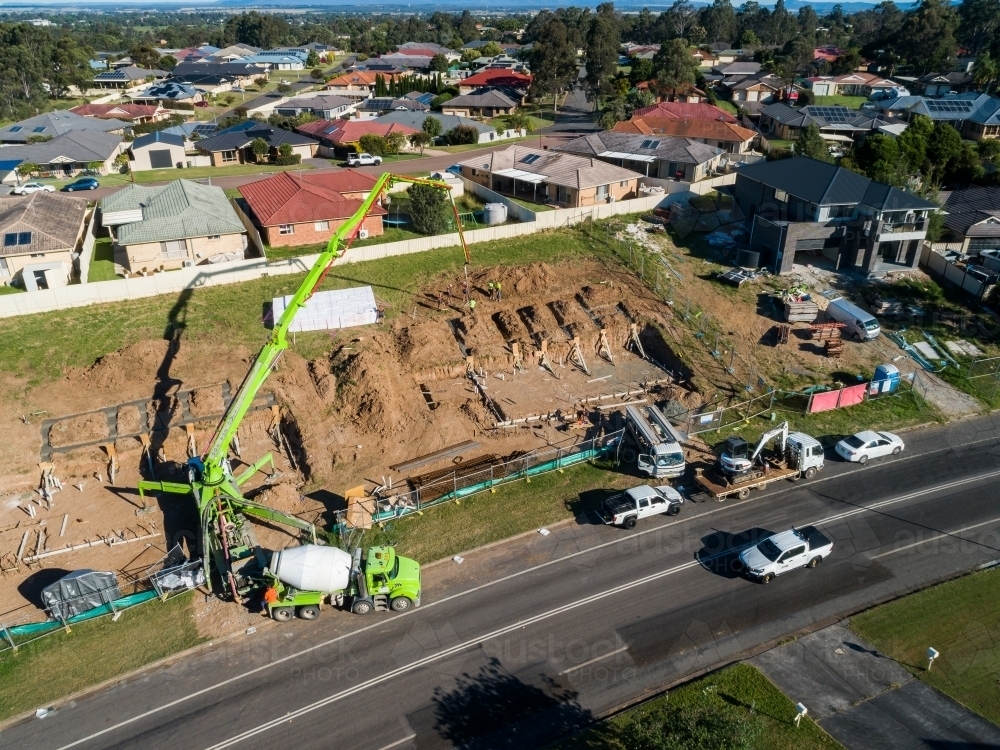 Cement truck pouring house foundations - Australian Stock Image